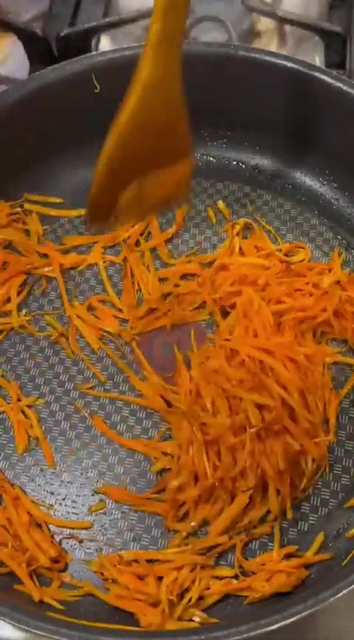 Sauté the carrots in melted butter until soft and browned.