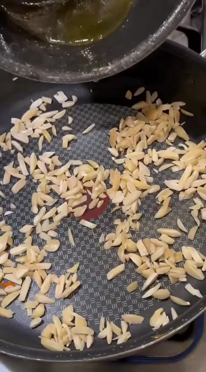 Toast the almonds with a little orange simple syrup until browned.