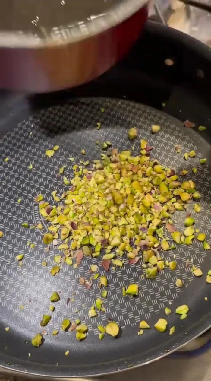 Toast the pistachios with a little orange simple syrup until glistening.