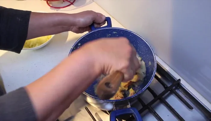 Add spices to the chicken mixture and mix well. Turn off the heat.