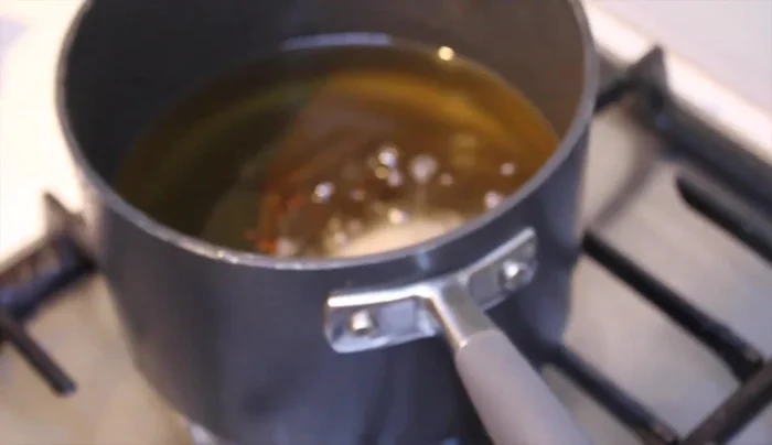 Fry the kibbeh in hot vegetable oil until golden brown.