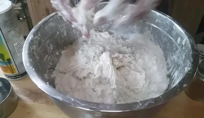 Cover the bowl with a towel and let the dough rise in a warm place until doubled in size.