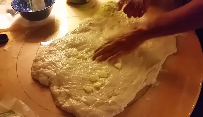 Place the shaped bread onto a baking sheet.