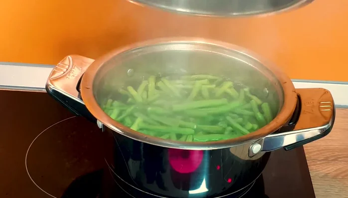 Boil water, add beans and 2 tbsp salt; cook until tender.