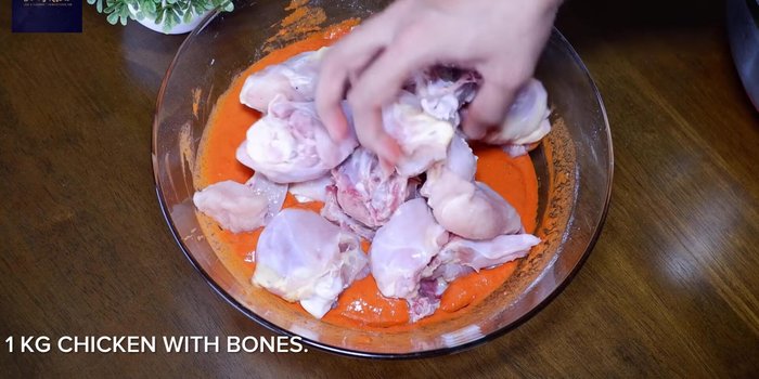 Add medium-sized chicken pieces and coat them well in the batter.