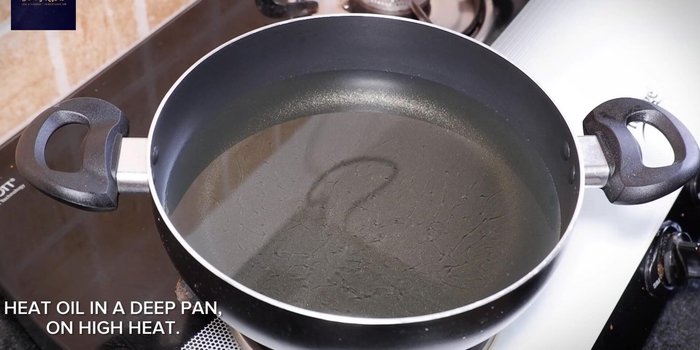 Heat oil in a pan on high heat, then reduce to medium-high.