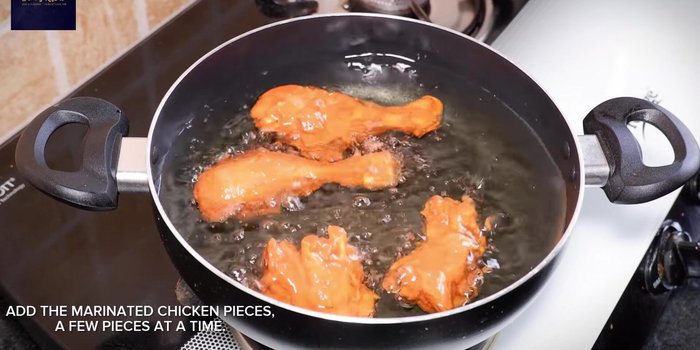 Add chicken pieces a few at a time, frying for 3-4 minutes per side until crispy.