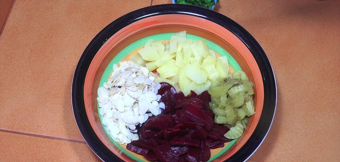 Add flaked almonds and pickles (if using).