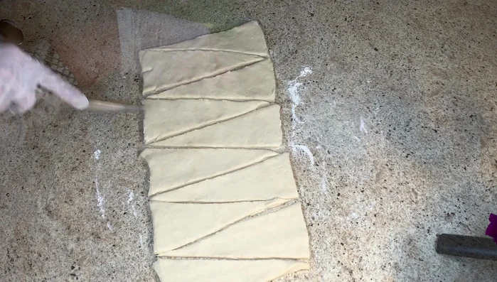 Add Zaatar filling to each triangle.
