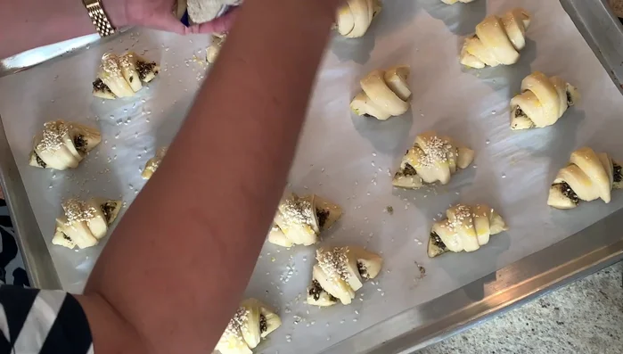 Remove from the oven, brush with egg wash, add sesame seeds, and bake at 350°F (180°C) for 10 minutes, or until brown.