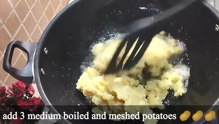 Add the mashed potatoes to the ghee and fry for 3-4 minutes until lightly golden.