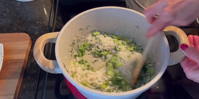 Add the soaked rice to the pan and sauté with the fava beans and dill for about a minute.