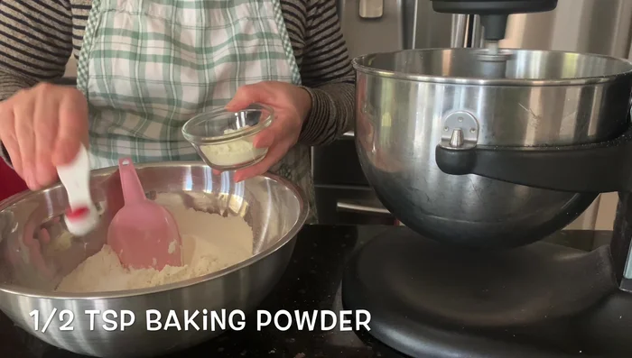 Add flour, baking powder, and salt to the wet ingredients. Mix until well combined.