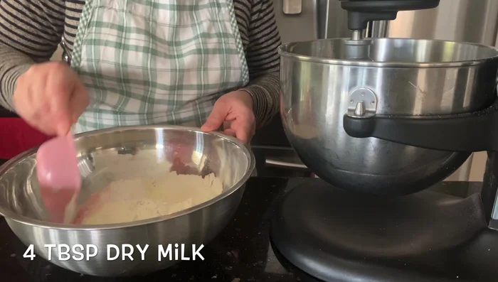 Add milk gradually, mixing until the dough is the right consistency. It shouldn't be too sticky.