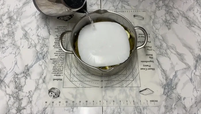 Slowly add boiling water to almost cover the dolma. (378.88)