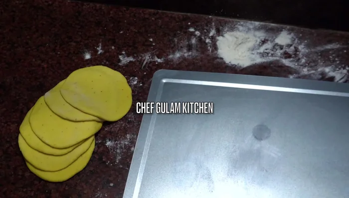 Place the rolled dough pieces onto a baking tray (224.239-232.84).