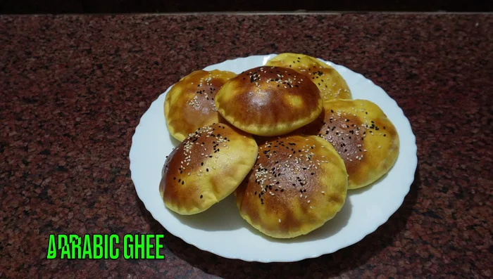 Remove from oven and let cool slightly. Serve with Arabic ghee and dates syrup or honey (299.96-320).