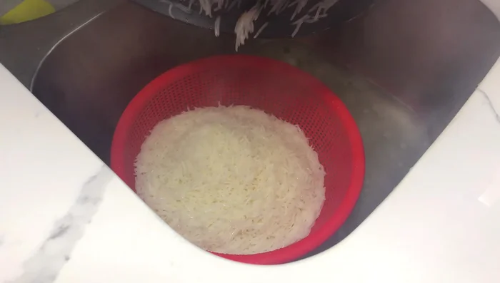 Drain the rice in a colander and set aside.