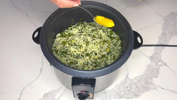 Once the rice is cooked, add 1 tbsp of ghee (or butter/oil) for extra flavor. Carefully invert the rice onto a serving platter.
