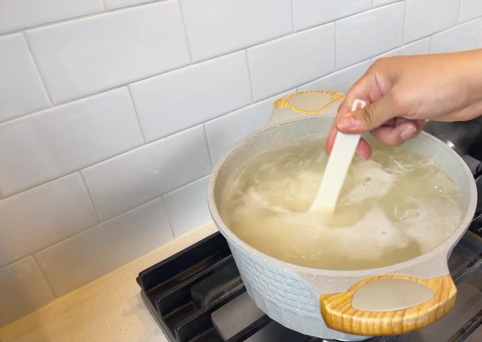 Bring a large pot of water to a boil. Add soaked rice and cook for 6-7 minutes until the rice grains are slightly undercooked. Drain the rice, put it back into the pot, cover, and let it steam for about 30 minutes.