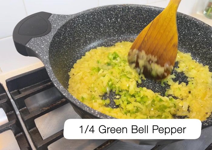 Add a finely chopped green bell pepper and cook for another minute.