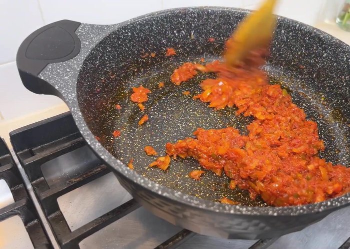 Stir in 2-3 tablespoons of tomato paste and cook to remove the raw taste.