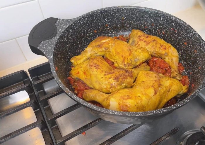 Return the chicken to the pan. Pour in hot water, cover, and simmer on low heat for 45 minutes.