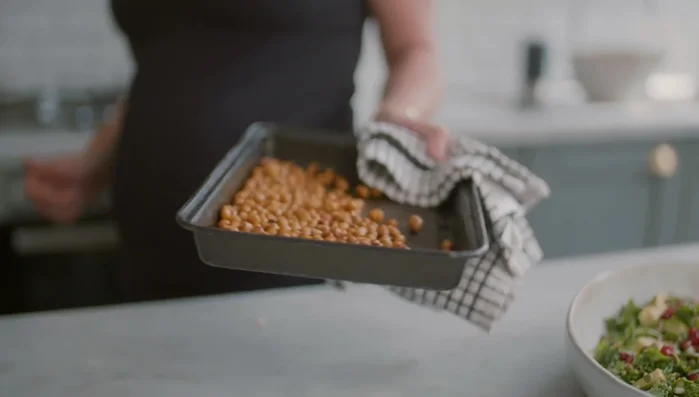 Add chickpeas: Once chickpeas are roasted, add them to the salad.