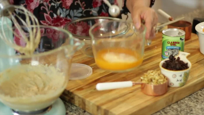 In a separate container, combine the orange juice with baking soda. This will cause it to fizz. Add this mixture to the tahini mixture and whisk until combined. (Note: If the mixture seizes up, add a couple of tablespoons of vegetable oil to help.)