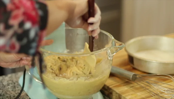 Transfer the batter to the prepared baking pan. Use a spatula to ensure all batter is transferred.