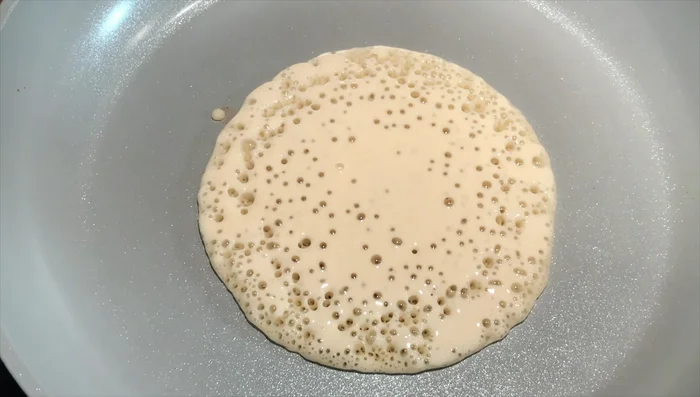Cook each pancake for about 10 minutes, until golden brown on the bottom with small bubbles on top.