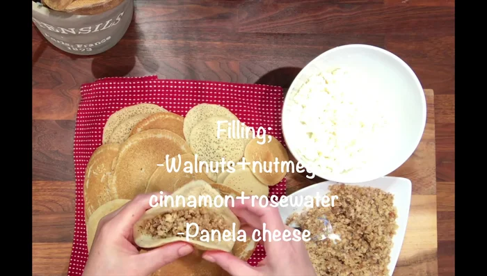 Fill the cooked qatayef with your chosen fillings.