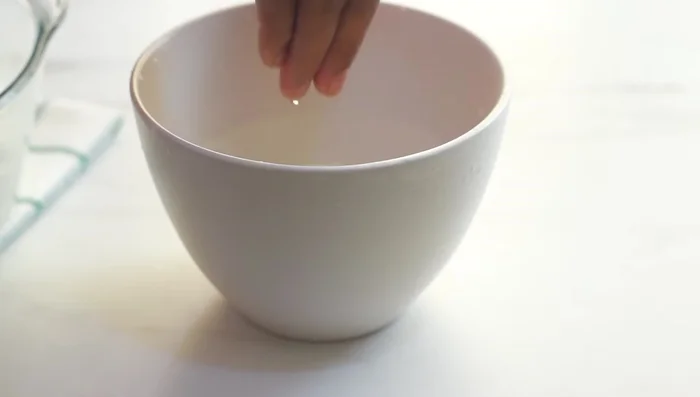 After 30 minutes, gently stretch and fold the dough several times to develop strength. This helps to deflate any trapped gas.