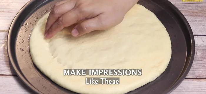Apply water to your fingers and cover the dough. Let it rest for 15 minutes.