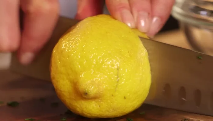 Prepare the dressing: Juice one large lemon (about 1/4 cup), whisk in 3 teaspoons of olive oil, chopped garlic, salt, and pepper.