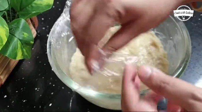 Knead again: After an hour, knead the dough again to make it smooth. Add a little more ghee if needed.