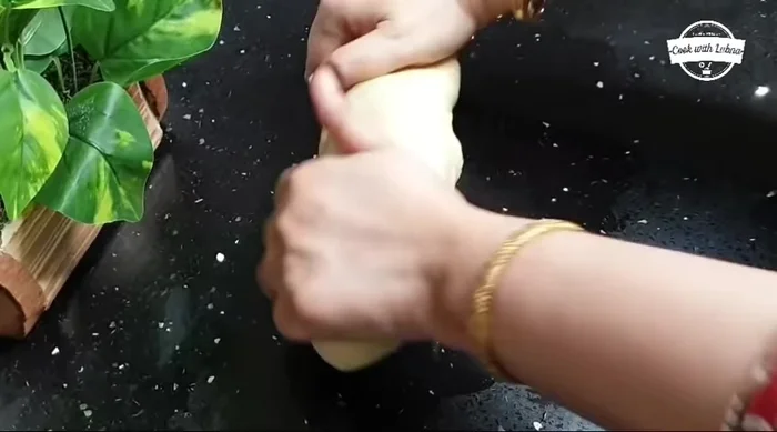 Shape the Sheermal: Divide the dough into small portions. Roll each portion into an oval shape.
