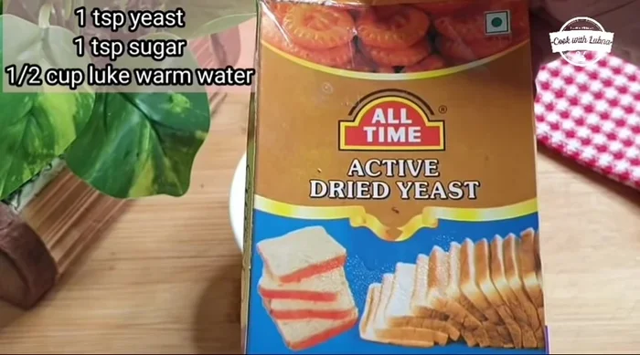 Activate the yeast: In a bowl, combine 1 tsp yeast, 1 tsp powdered sugar, and 0.5 cup lukewarm water. Let it stand for 10 minutes until foamy.