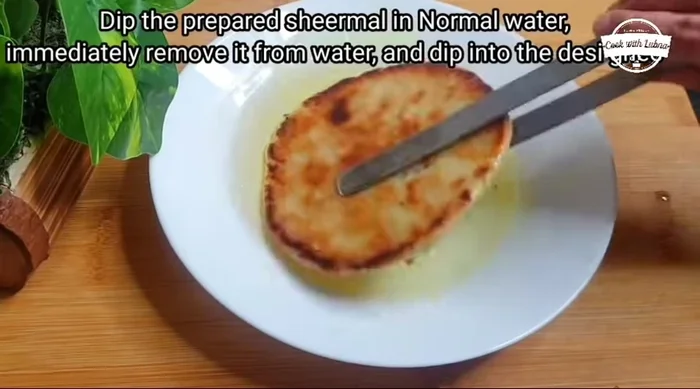 Finish: Immediately after baking, dip each Sheermal in water for a few seconds, then dip it briefly in hot desi ghee.