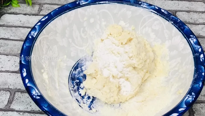 Using a spoon, carefully drop spoonfuls of the dough into the hot oil.