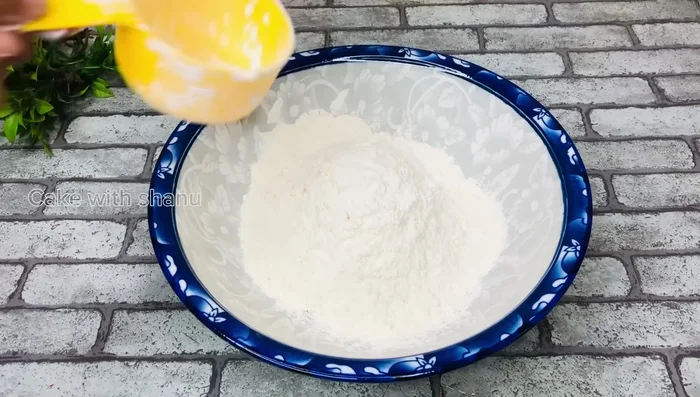 Prepare the dough using flour, sugar, water, and yeast. (Specific measurements are unclear in the transcript)