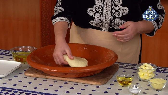 Divide and shape the dough: Divide the rested dough into smaller balls (about 60 grams each). Oil your hands to prevent sticking.