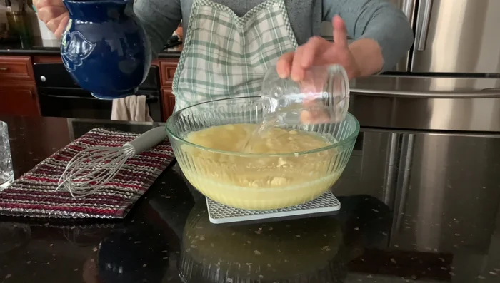 Add the semolina mixture to the water mixture. Mix slowly with a whisk.
