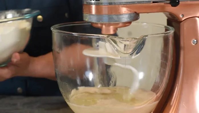 Combine wet and dry ingredients (yeast mixture, oil, flour mixture). Knead into a soft dough.
