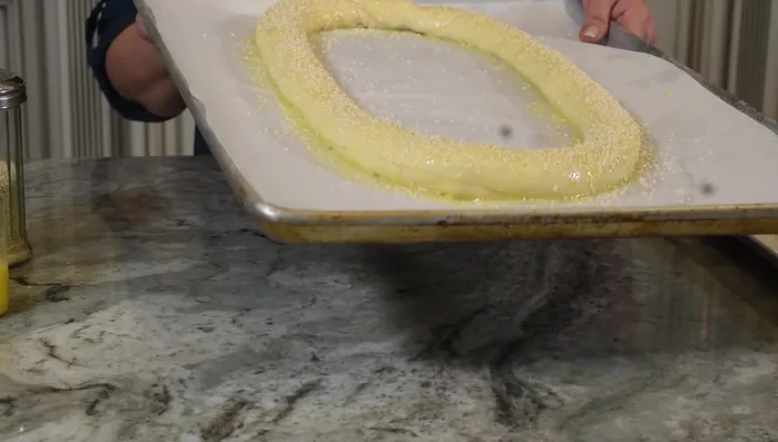 Brush the rings with beaten egg and sprinkle with sesame seeds.