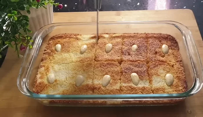Once the basbousa is baked, make the marks on the surface more prominent using a knife.