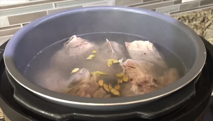 Add 16 pieces of cardamom to the pressure cooker. Cook on high for 30 minutes (or 1.5-2 hours on a stovetop).