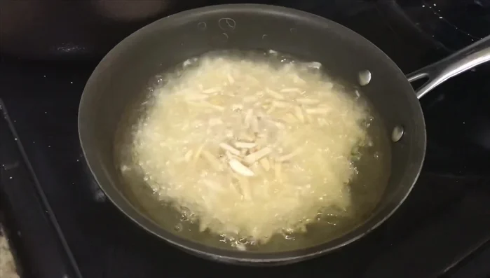 Fry 1/2 cup of almonds until golden brown.