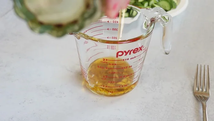 Prepare the dressing: Combine chopped garlic, olive oil, lemon juice, mint, sumac, and salt.