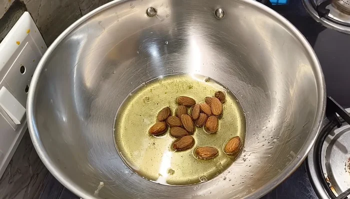 Remove the poppy seeds. Add almonds, cashews, walnuts, raisins, chironji, and pistachios to the ghee one by one, roasting them lightly until fragrant. Remove and set aside.
